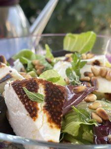 Fresh green salad with grilled manouri